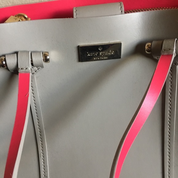 grey and pink handbag